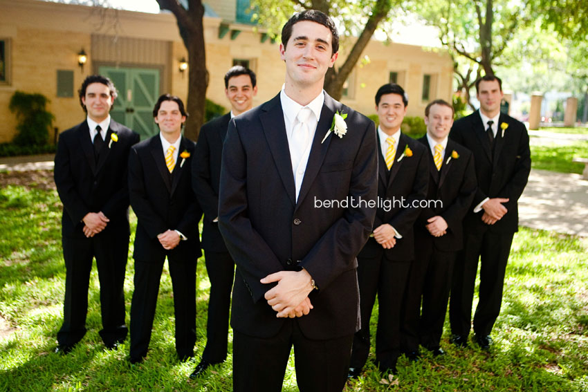Adding groomsmen with yellow ties and boutonnieres