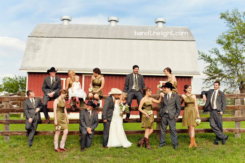Bridesmaids and groomsmen with cowboy boots and cowboy hats already 
